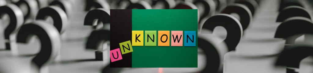 A colourful collage of sticky notes spelling out the word "UNKNOWN" is placed against a green and black background, with a blurred field of black question marks in the backdrop symbolising ambiguity and lack of clarity.
