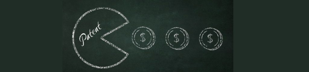 Chalk drawing of a Pac-Man-like shape labeled "Patent" appearing to eat three dollar signs, symbolising the high costs associated with patents.