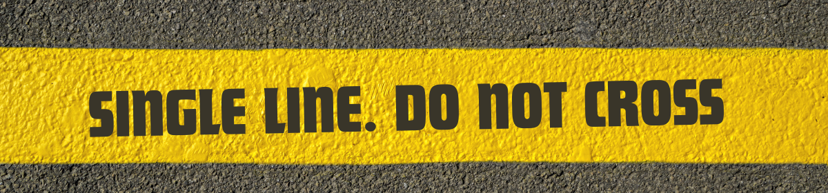 Yellow road marking with bold black text reading “SINGLE LINE. DO NOT CROSS,” symbolizing the lack of reasoning in the Stromag GmbH patent refusal—a single-line decision that violated principles of natural justice.