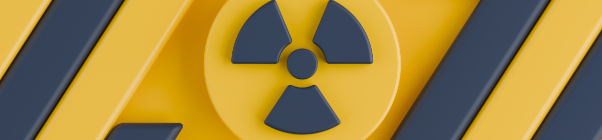 Radioactive hazard symbol on yellow and dark grey striped background, illustrating patent rejection atomic energy India