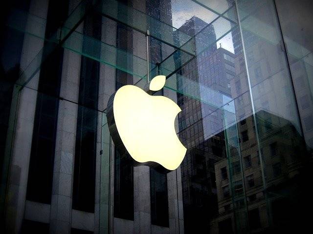 The image depicts the Apple Inc logo against a glass building. The post is about a suit for anti-competitive practice and copyright against apple. To read more click here.