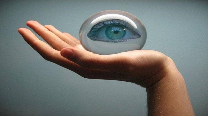 This image depicts a hand holding a glass ball having image of an eye over it. This image is relevant as it shows the Technological Growth using Patents. Click on the image for full description.
