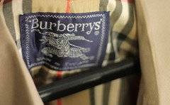The featured image shows the logo of the fashion house Burberry which is affixed to a particular cloth. The post is about a dispute between the Fashion house Burberry and music producer Perry Moise. To know more, please click here.